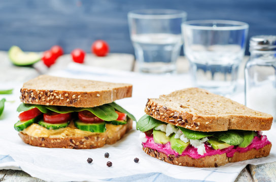 rye sandwiches with carrots and beetroot hummus and vegetables