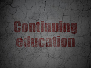 Education concept: Continuing Education on grunge wall background