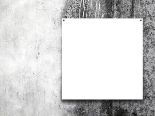 Close-up of one nailed blank square frame on grey dirty wall background 