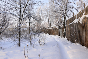 Road in snow in cold winter day