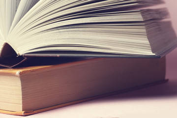 Vintage old books on light background