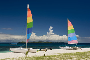 Catamarans on sandy beach. Fiji, South pacific.