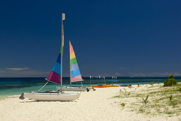 Catamarans on sandy beach. Fiji, South pacific.