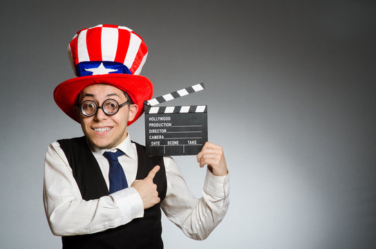 Man with american hat and movie board