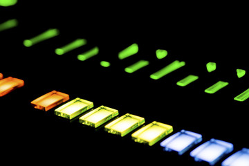 Lit buttons on a mixing panel
