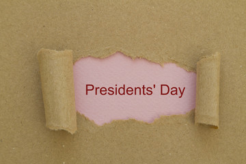 Presidents day written under torn paper.