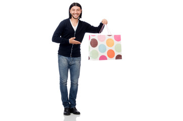 Young man holding plastic bags isolated on white