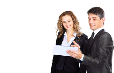 Successful young business team. Man and woman isolated over white with tablet.