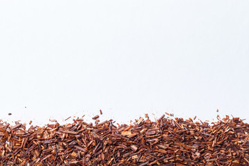 Dry rooibos tea leaves as texture for background - 107107747