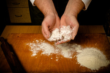 The process of making home bread by male hands. Toned