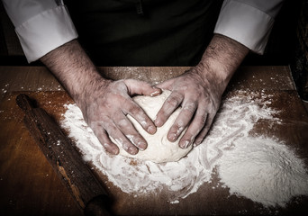 The process of making home bread by male hands. Toned