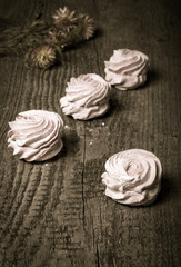 Fototapeta na wymiar Fresh pink homemade zephyr - marshmallow on old wooden table. To