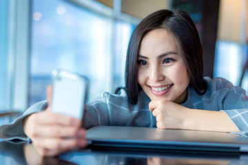 Asian woman, talking on the phone