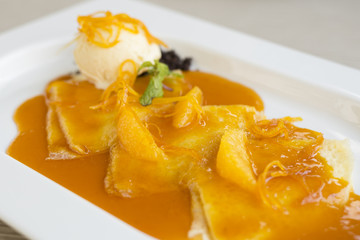 Crepes with orange flavor Sue Seth vanilla ice cream.
