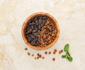 raisins in a wooden dish