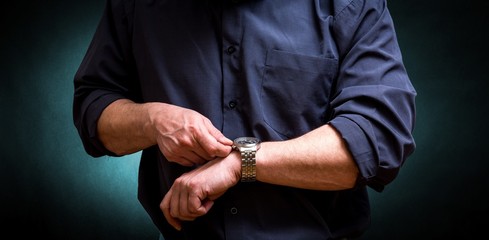 Business man stretching watch   dark background