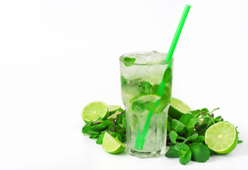 mojito cocktail with lime and mint in tumbler glass