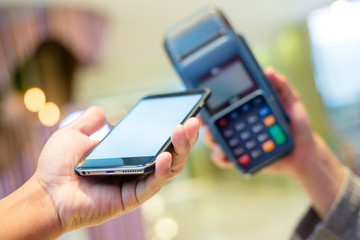 Customer using cellphone to pay