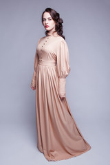 Portrait of young woman in retro dress