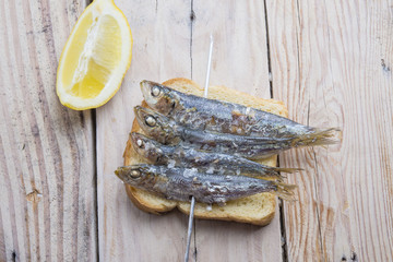 fried sardines on the plate