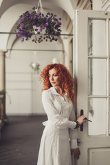 young girl ginger hair posing in the street