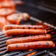 Fototapeten grilling hot dogs over open flame © Joshua Resnick