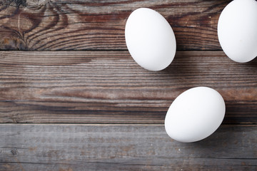 White eggs on the old wood table