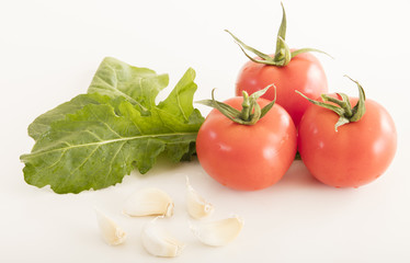 photo of very fresh tomatoes presented on white background