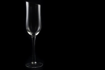 Empty champagne glass on black background