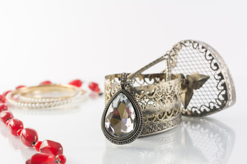 Vintage oval pendant with shiny stone on white background