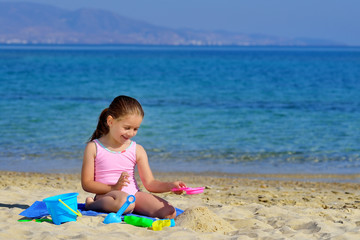 Fototapeta na wymiar Real toddler girl enjoying her summer vacation