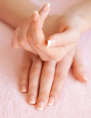 Woman hands with beautiful french manicure
