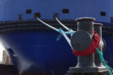 rope anchoring the ship backgriund. mooring end