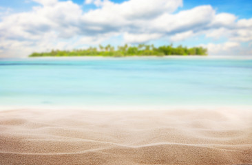 Sandy tropical beach with island on background