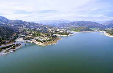 Aerial view of the earthfill dam (aka Embankment Dam) in Yermasoyia,Limassol,Cyprus. The bridge leading to the mountains, the water reservoir, artificial lake and the nature trails in Germasogia area.