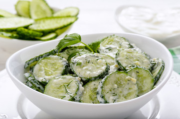 Fresh cucumber salad with yogurt and herbs.