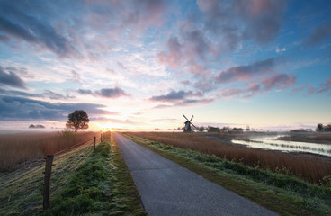 bike road, windmill in sunrise