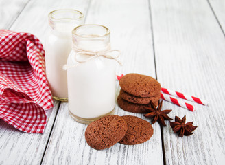 oatmeal cookies and bottles of milk