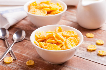 Cornflakes and milk for breakfast closeup