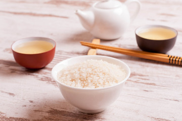 rice, green tea and chopsticks for sushi