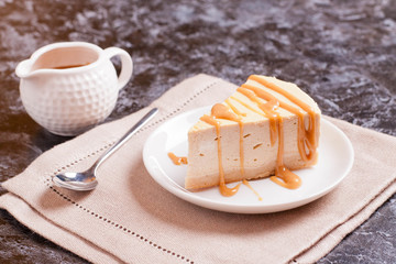 Cheesecake with caramel drizzle, served on plate