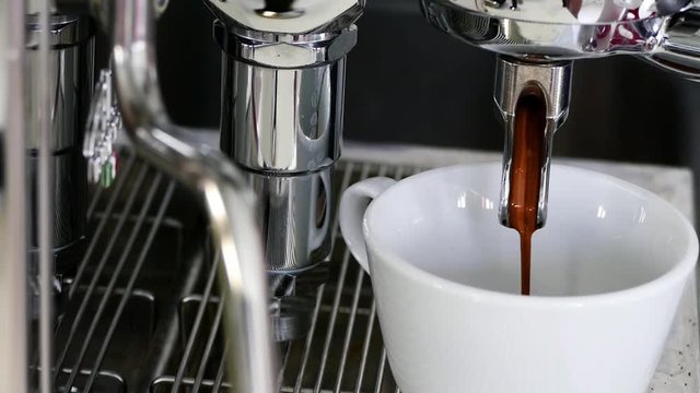 Pouring coffee in to the cup