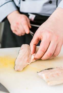 chef cutting fish