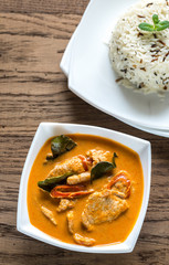 Thai panang curry with bowl of white and wild rice