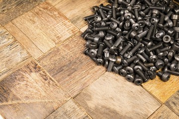 A pile of computer metallic screws. Macro shot.