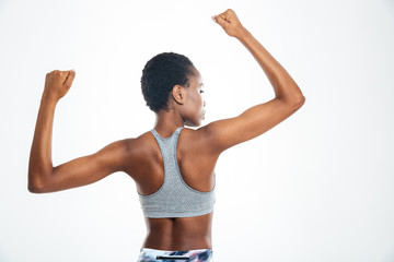 Fototapeta na wymiar Afro american woman showing her biceps