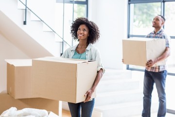 Young couple moving together in a new house 
