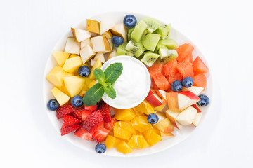 ingredients for fruit salad and natural yoghurt, top view