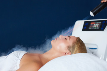 Woman receiving local cryotherapy therapy