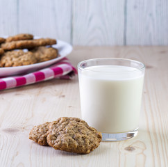 Glass of milk and oatmeal cookies